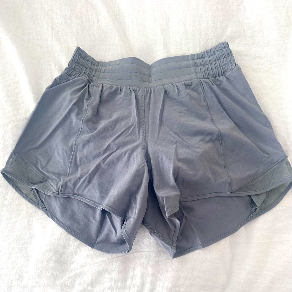 NWOT tags Lululemon size 4 gray shirts, 5" inseam.